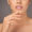 Makeup, beauty and lips of girl in studio with kiss, closeup and glossy mouth with healthy glow. Skincare, cosmetics and woman with natural lipstick color, luxury filler and shine on gray background.